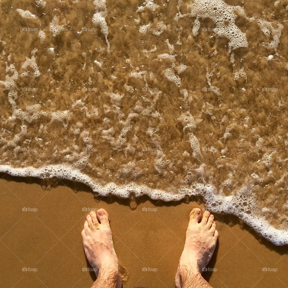 A man standing on the beach 