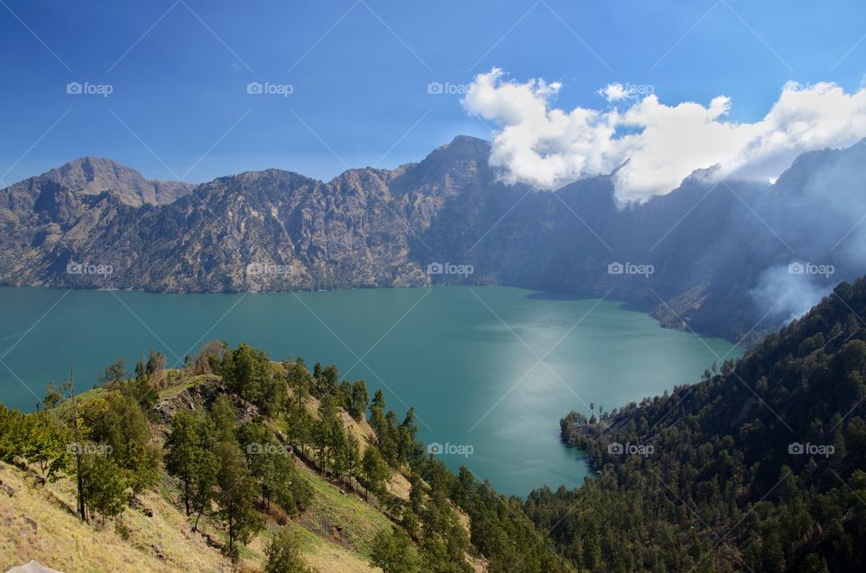Beautiful nature background Segara Anak Lake. Mount Rinjani is an active volcano in Lombok, indonesia. Soft focus due to long exposure.
