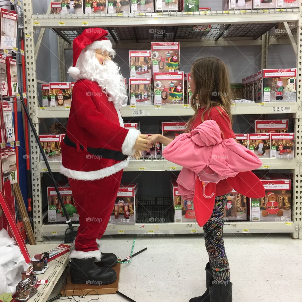Girl shaking Santas hand