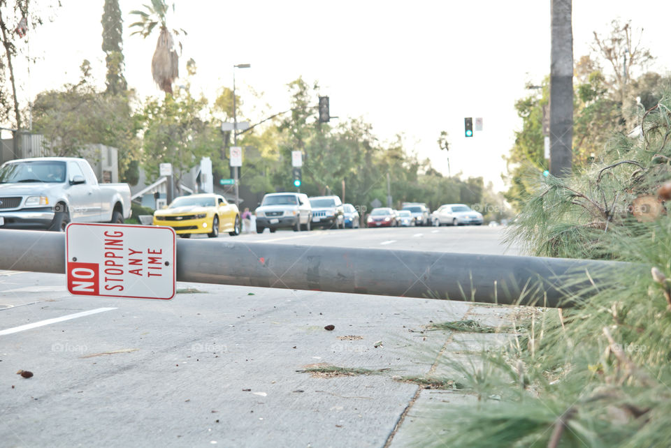 Fallen street pole blocking partial road