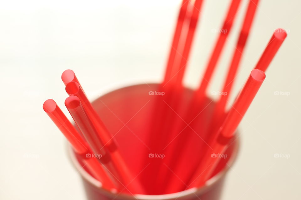 Red straws in glass