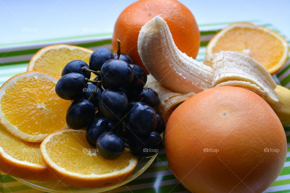 fresh fruits green table top view background