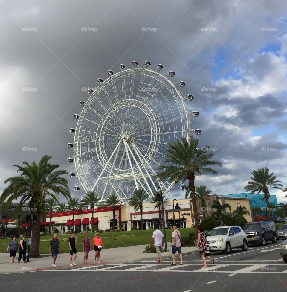 Holiday. Ferries wheel. Amusement park. Vacation. Summer. Travel. Orlando. City. People. Fun. 