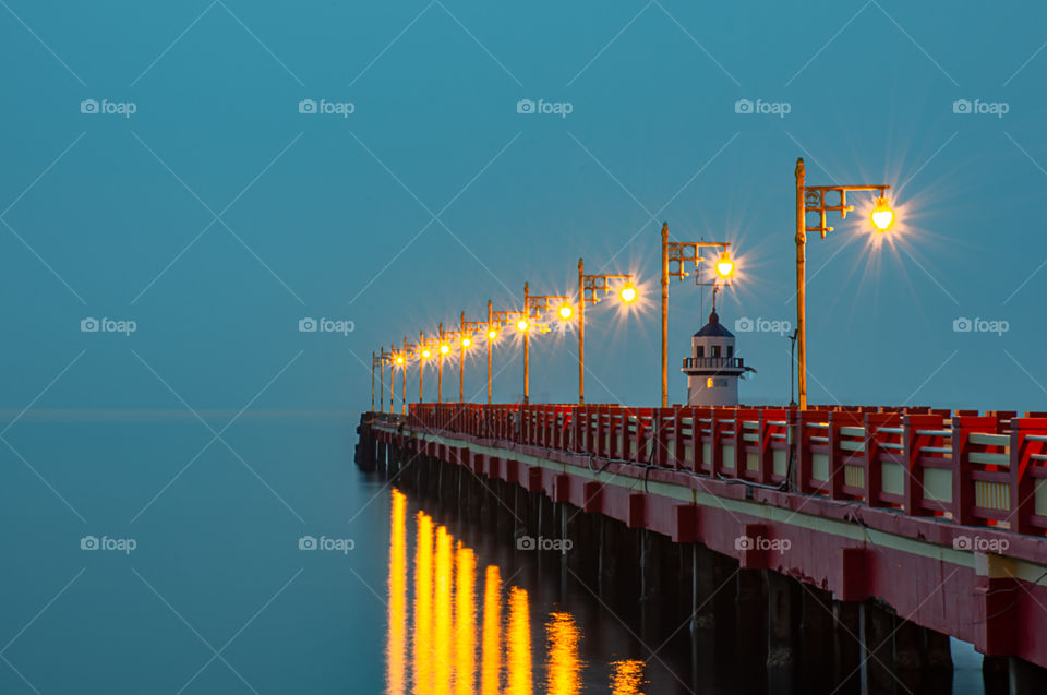 The lights on the bridge at night Background Sea  at Prachuap Bay in Thailand.