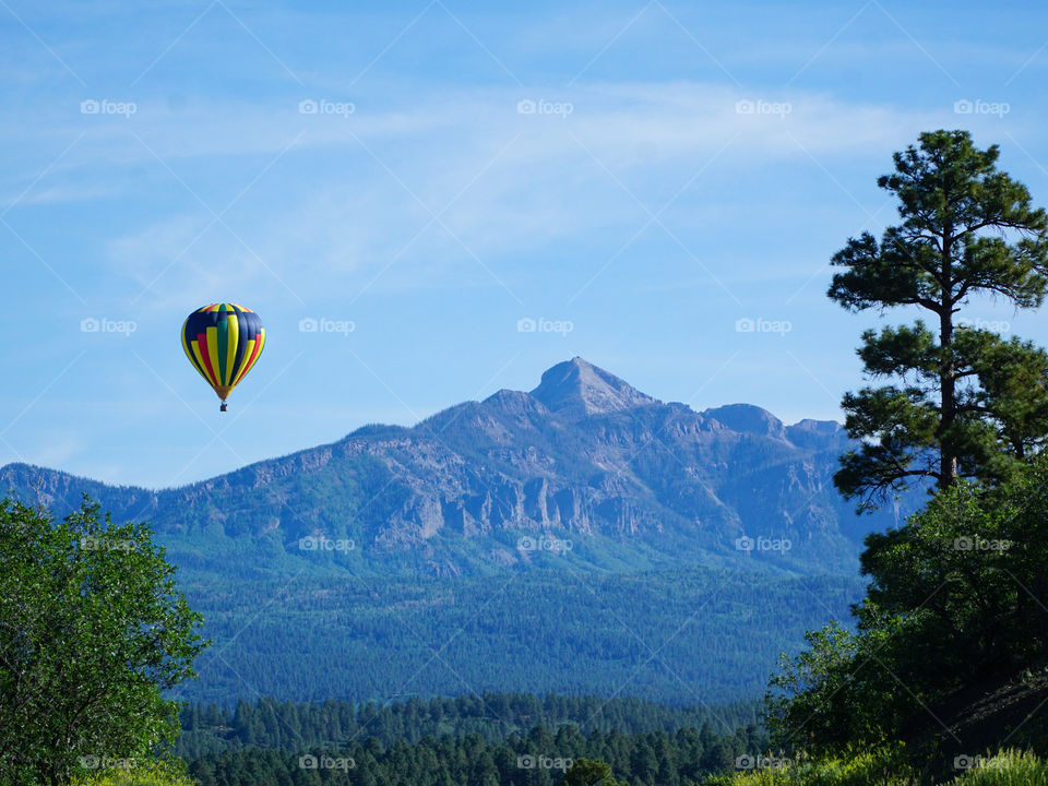 Hot air balloon with blue mountain backdrop