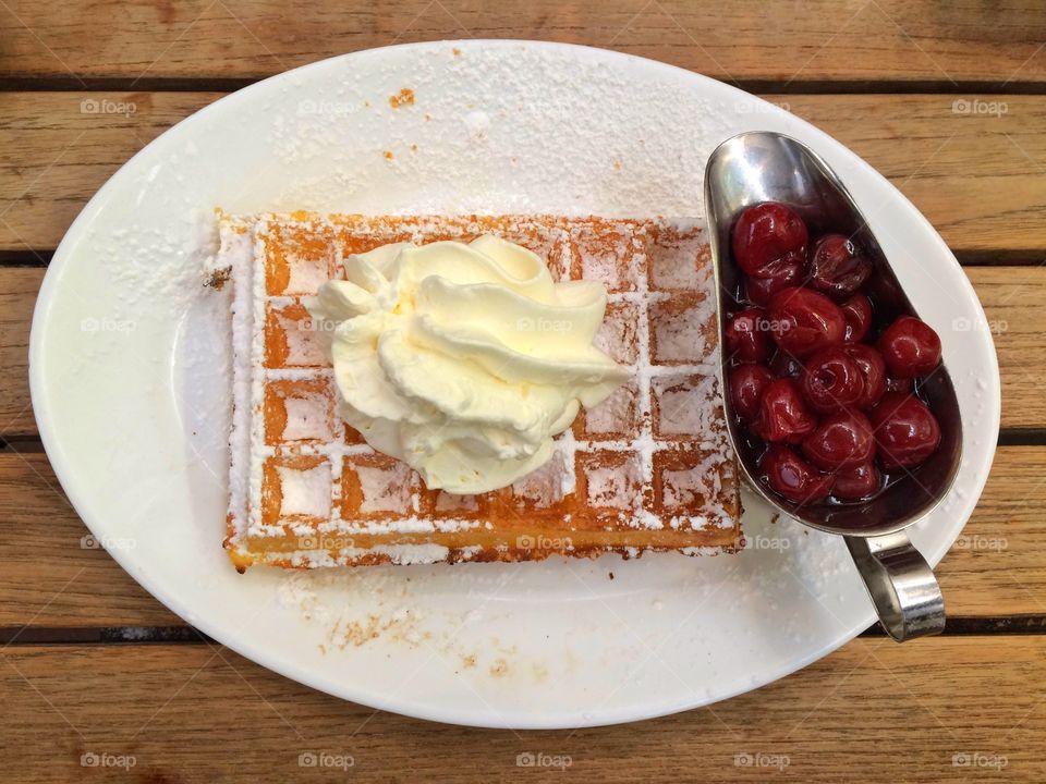 Yummy Belgian waffle with cherries