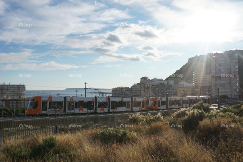 Train#city#view#mountain#sky#sun#rays