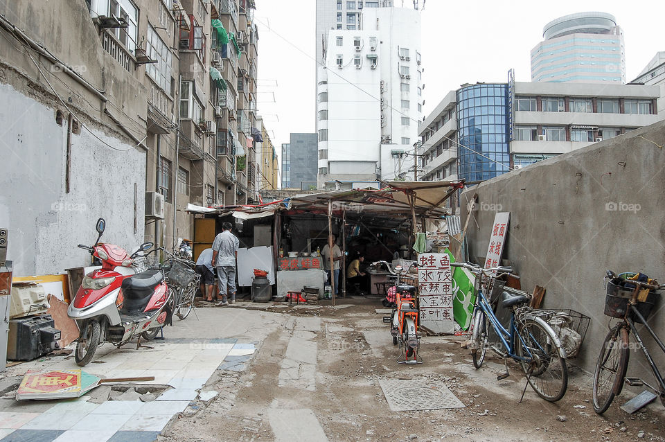 Remaining slum between skyscrapers