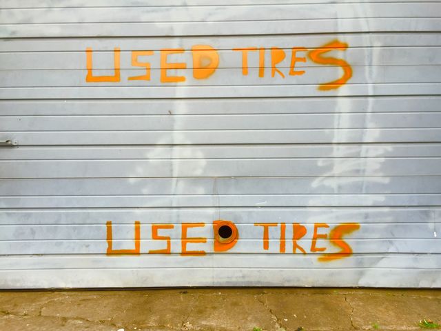 Used tires. Hand painted sign