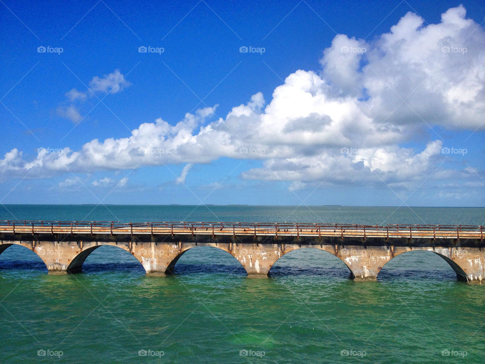 blue clouds vacation bridge by jomagraphy