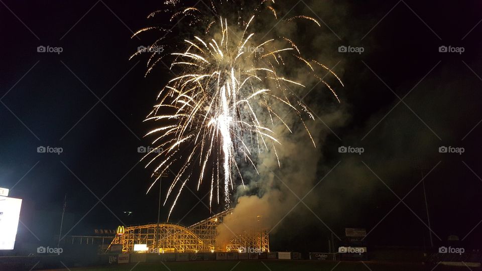 Fireworks over an old wooden roller coaster after an Altoona Curve baseball game in Altoona, PA