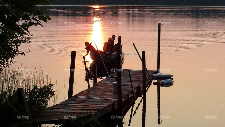 boat returns. evening return