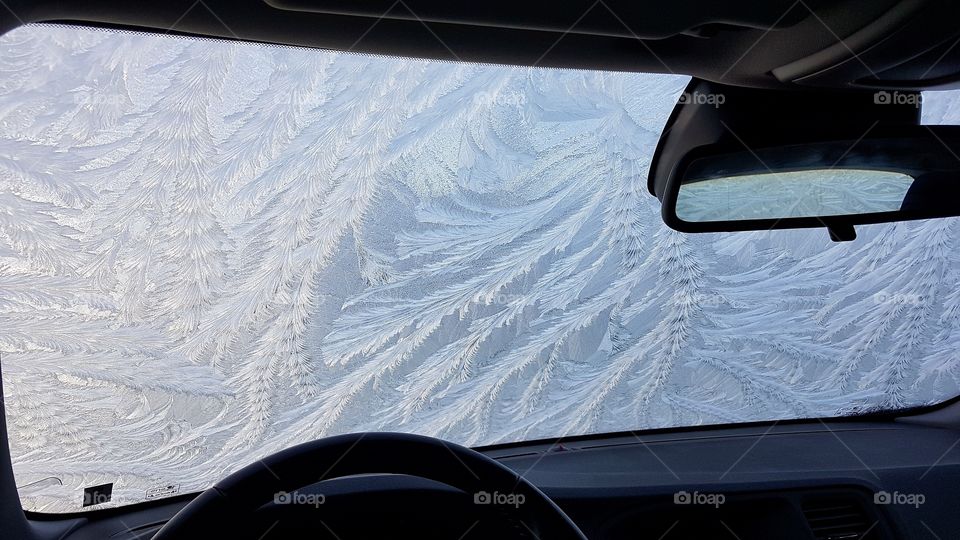 Windshield covered with frost ice pattern  - vindruta på bil täckt med frost is mönster 
