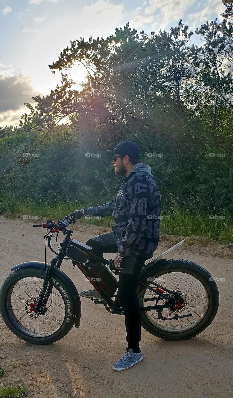 men on a electric motorcycle, summer time