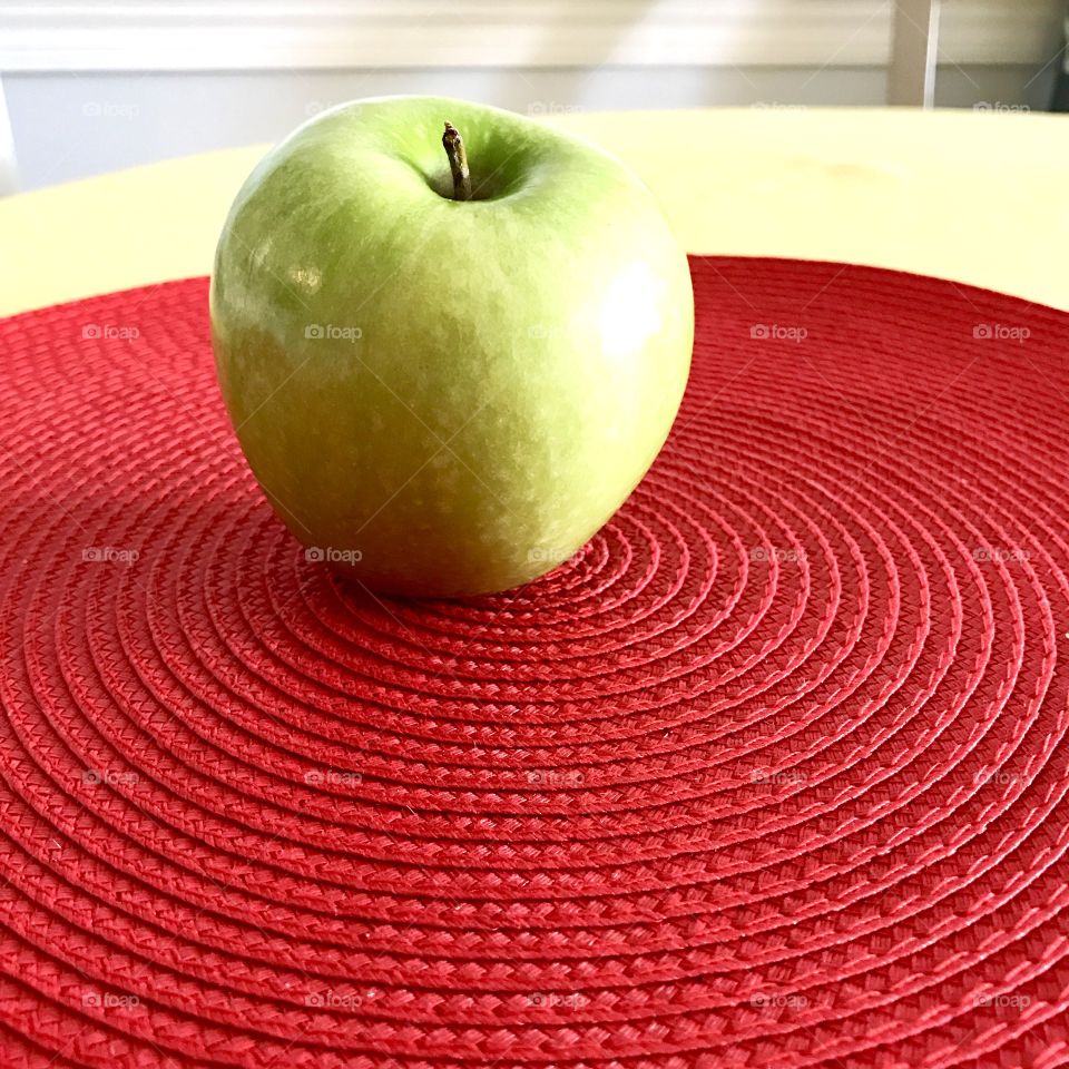 Green Apple on Red Placemat