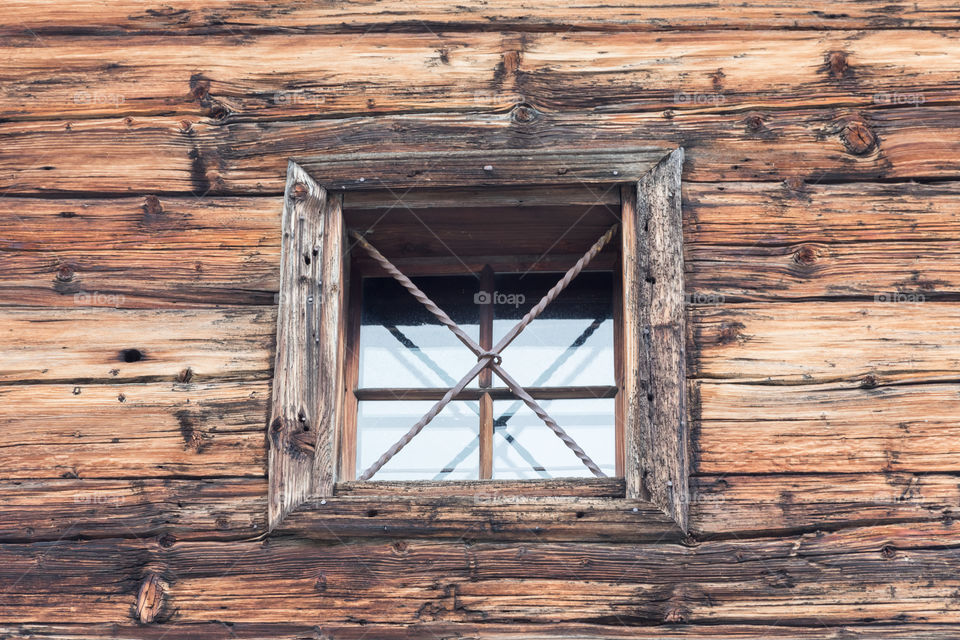 Old wooden window with crossbars, lines and shapes 