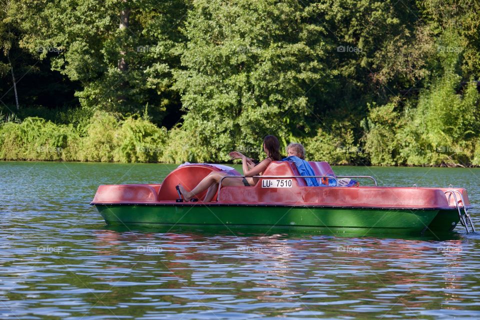 People On Lake With A Pedalo