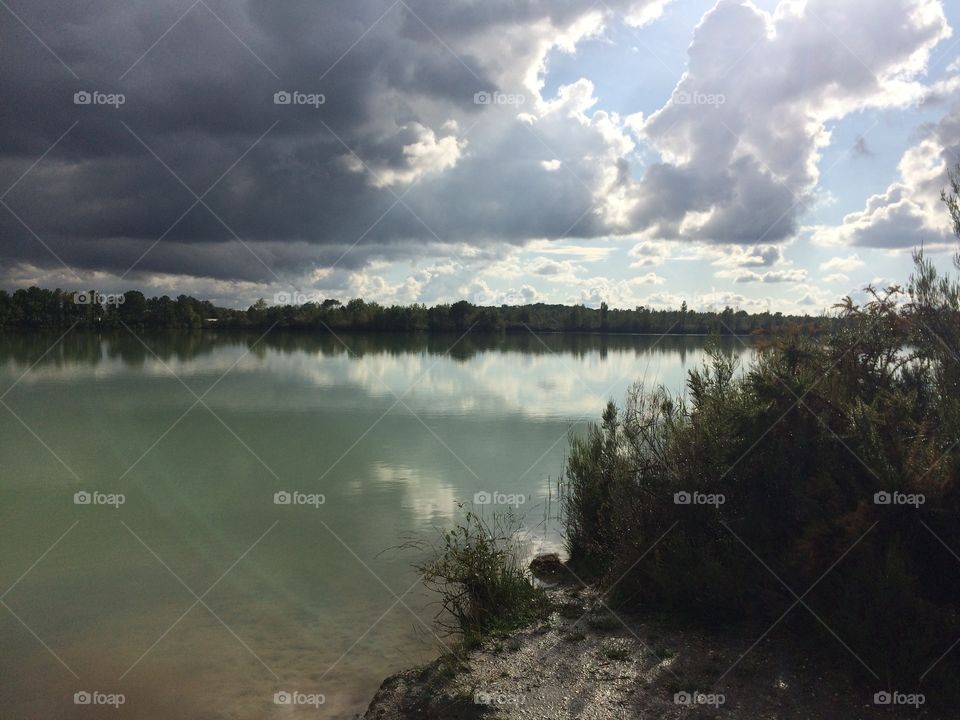 Clouds and sun on the lake
