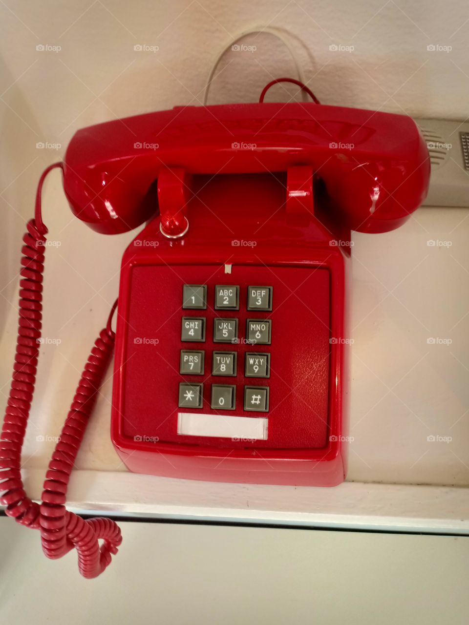 Red Antique Telephone  Equipment or tools for communication  That people use and buy as collectibles.