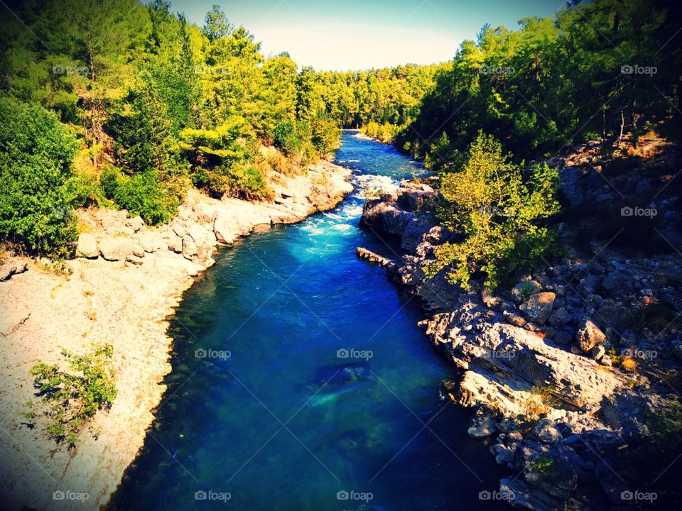 The beautiful and fairytale mountain river with beautiful nature with rocks and trees.