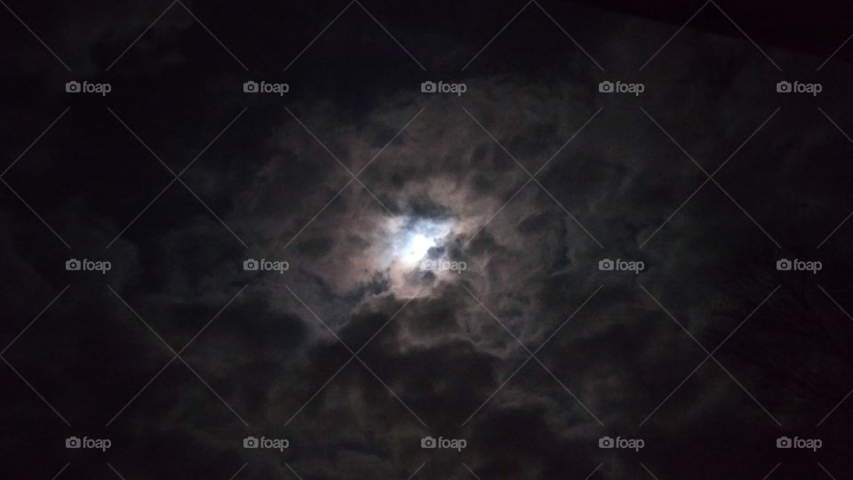 Full moon through clouds