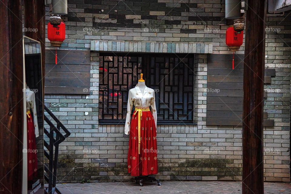 The dress is placed in a street to attract people