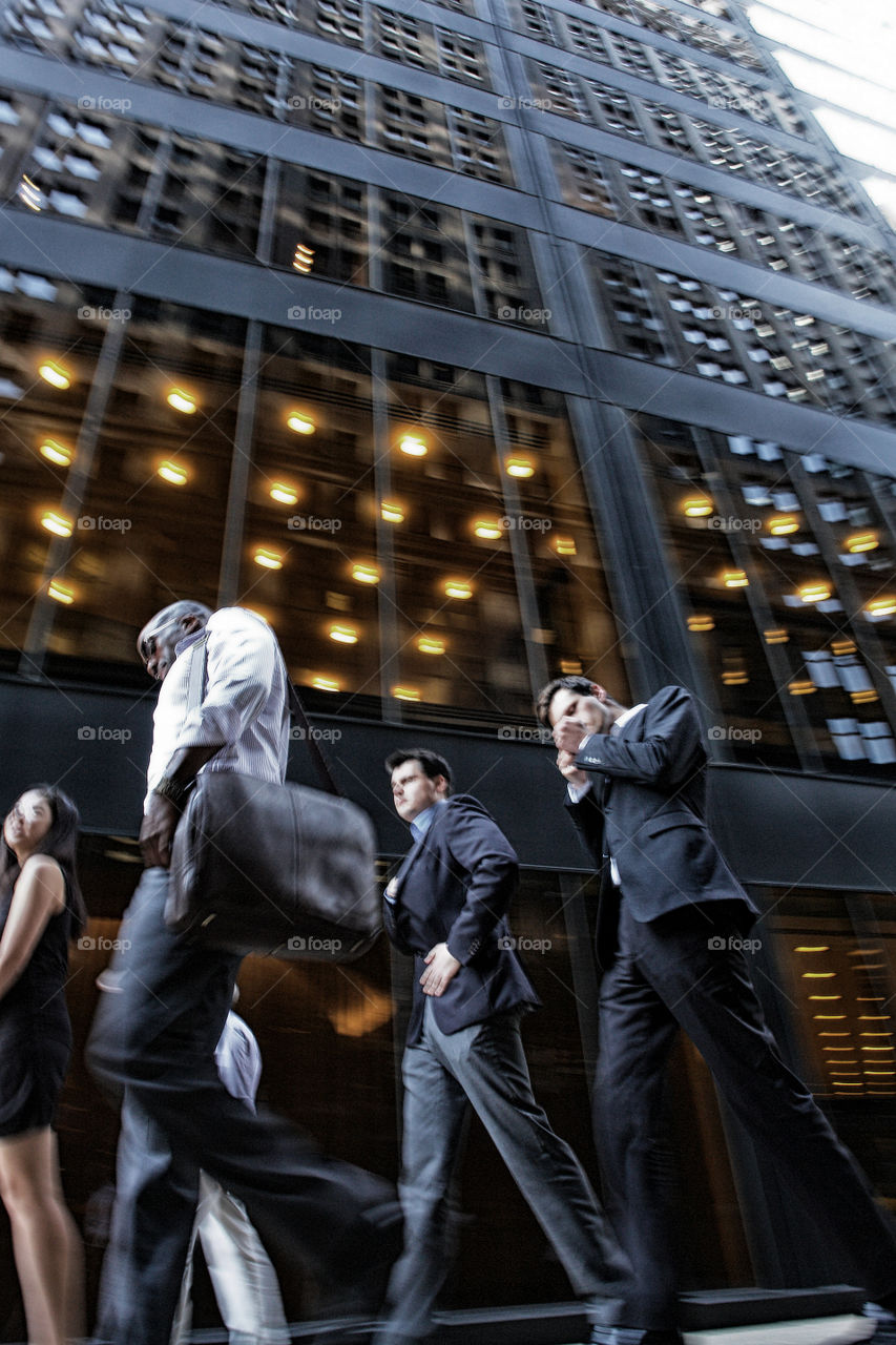 Business men in New York. I was cruising on the Wall Street and people were leaving from work
