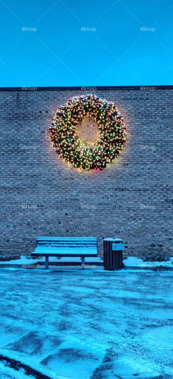 Christmas decorations and a bench with a snow