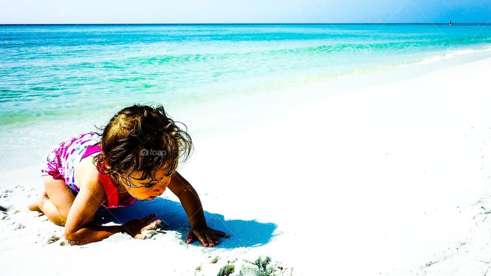 Little girl enjoying on beach