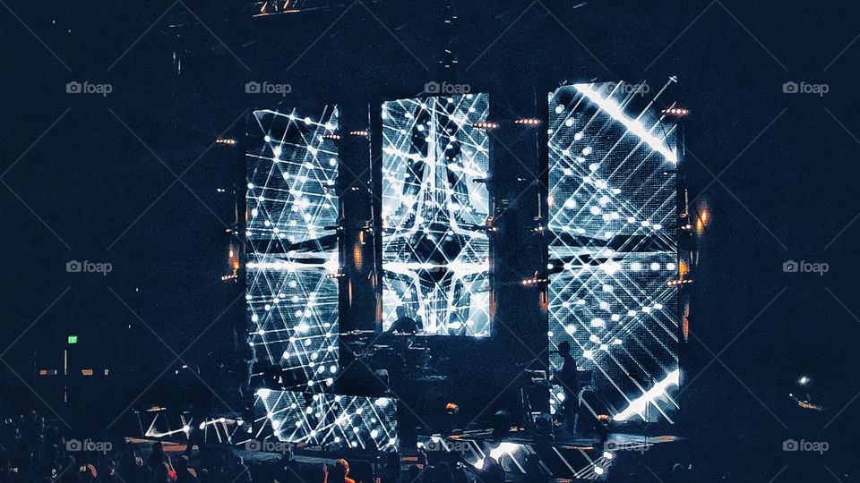 Concert stage projector and stage lights creating pattern 