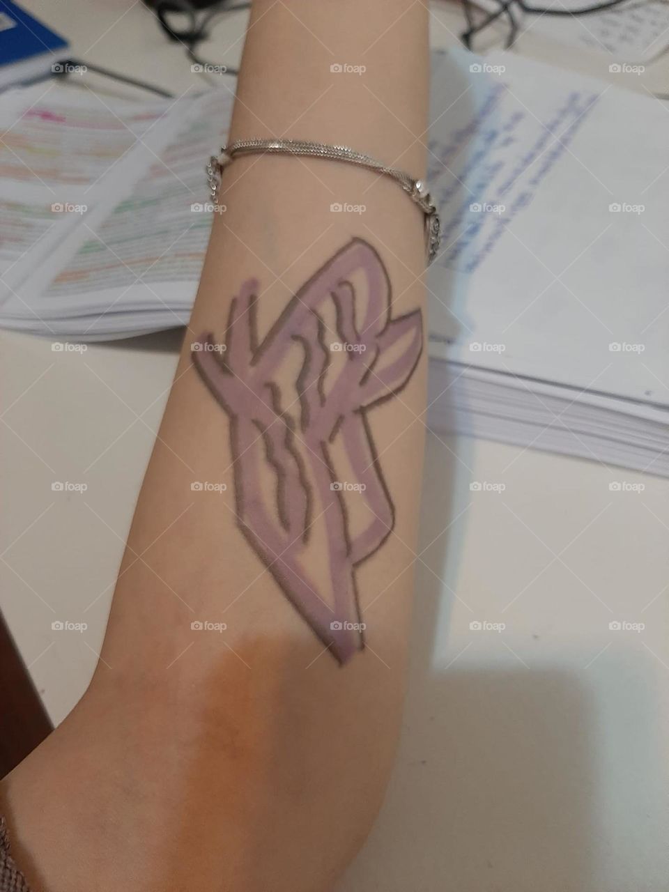 tatooed and bracelet forearm