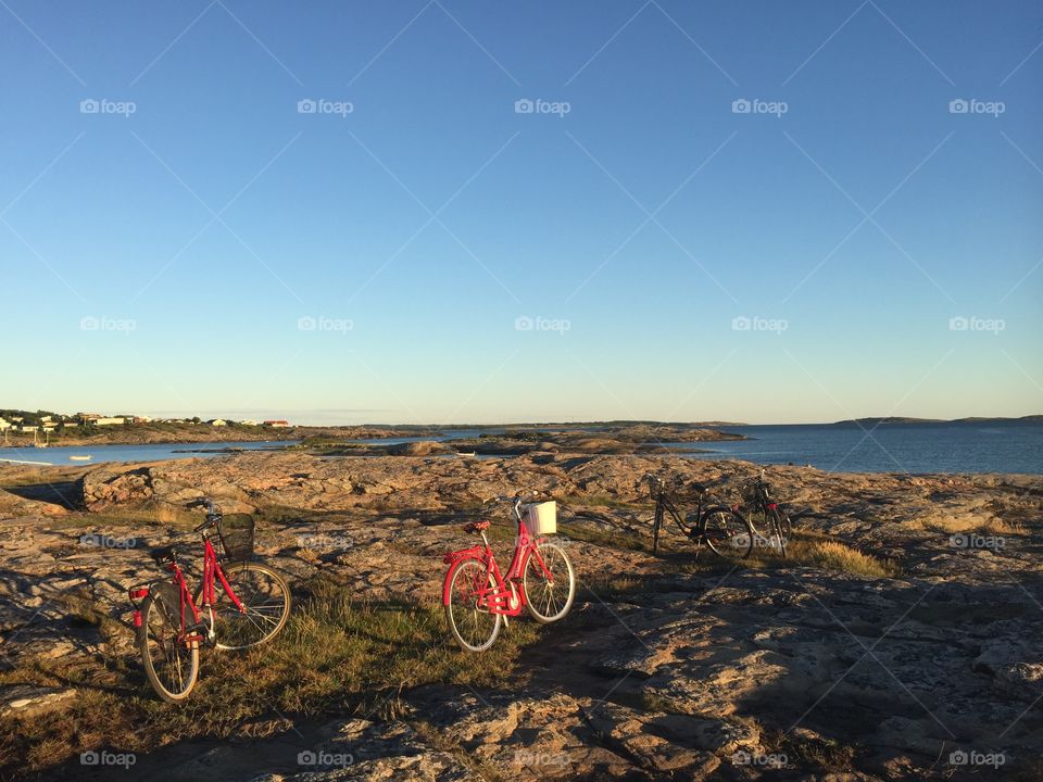 Red bikes in cliffy beach