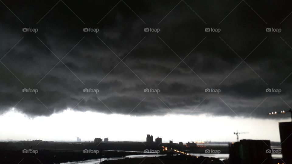 Dark Low Heavy Clouds over cityscape