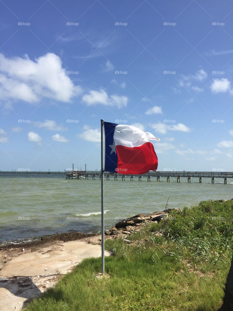Texas flag near the water
