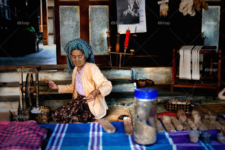 old women making hand make linen
