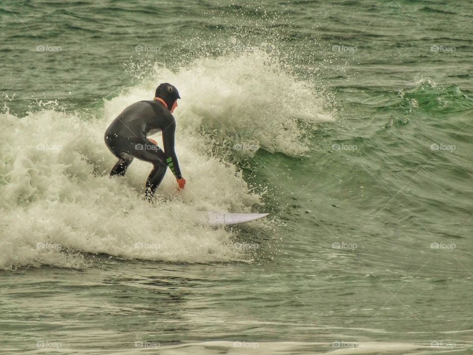 Surfer In Cold Water. California Surfing