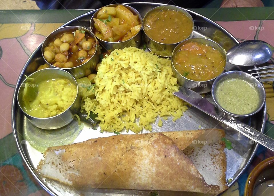 Ayurvedic Indian Cuisine.  Round Tray with Variety of Dishes and Saffron Jasmin Rice