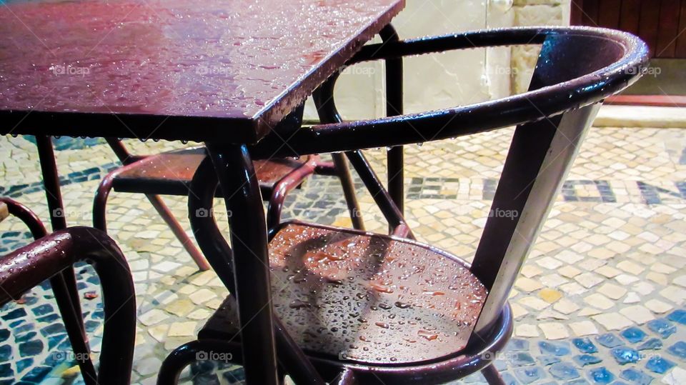 Wet outdoor furniture closeup 