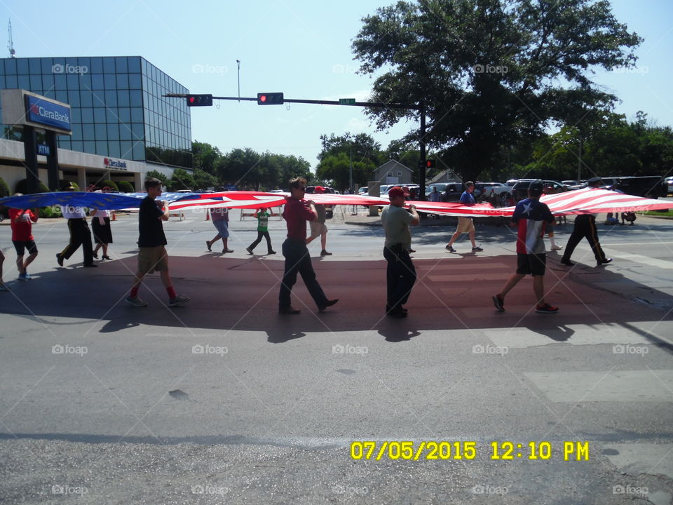 flag bearers 2. This is another picture of the same flag bearers carrying the American flag in the local fourth of July parade
