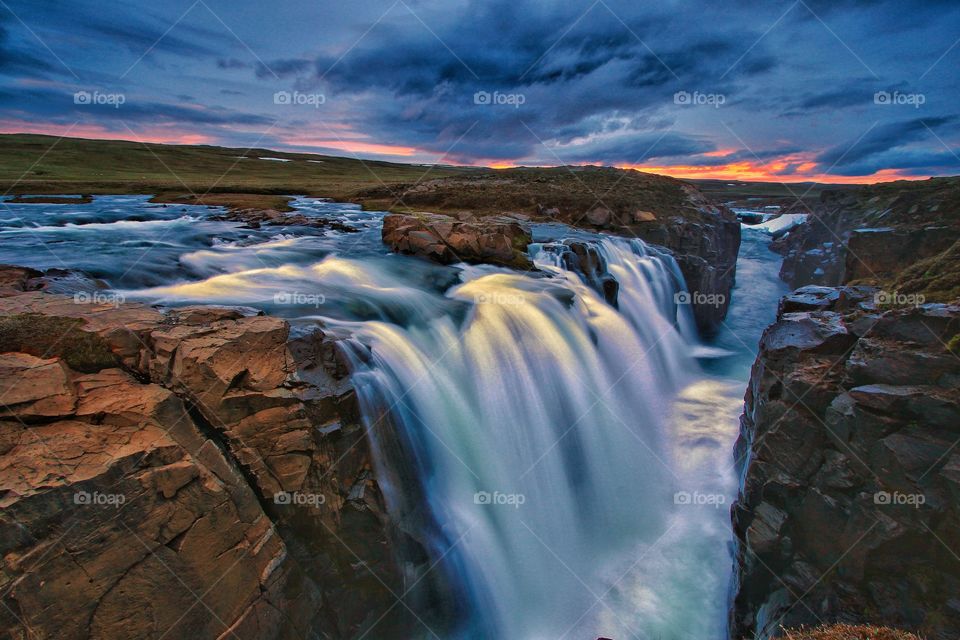 Scenic view of water on rocky mountain