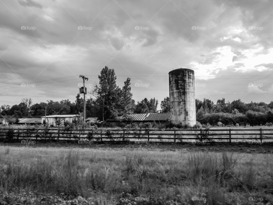 black and white grain silo on farm