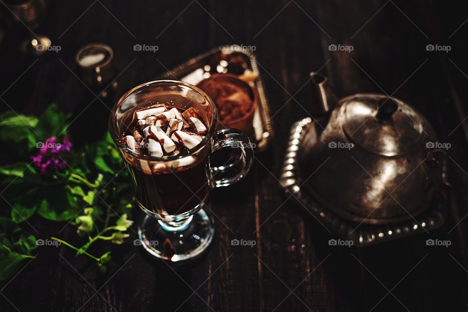 Hot chocolate with marshmallows on a wood table 