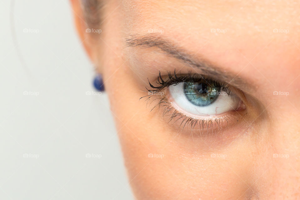 Macro of blue eye of female