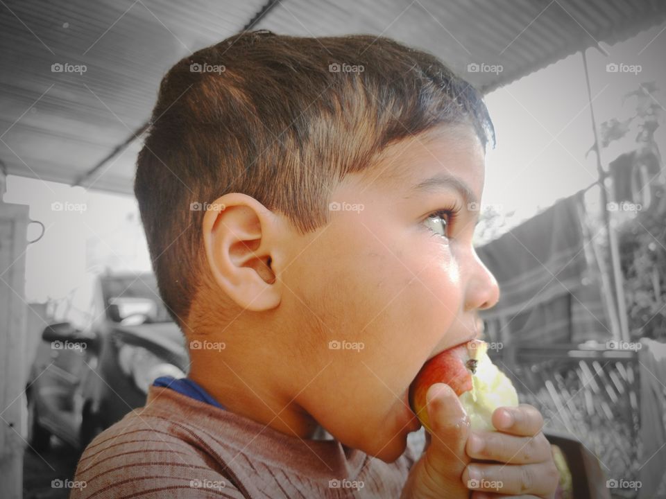 Hungary boy eating and weeping and waiting for mom