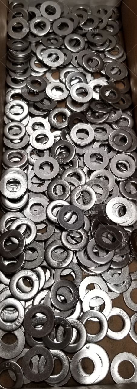 Round Builders hardware for fastening nuts and bolts.