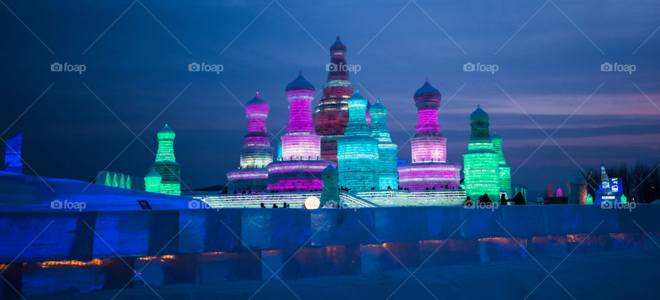 Asia china  Harbin ice Festival snow Festival ice sculptures snow building  snow ice in light colorful ice buildings at night full moon