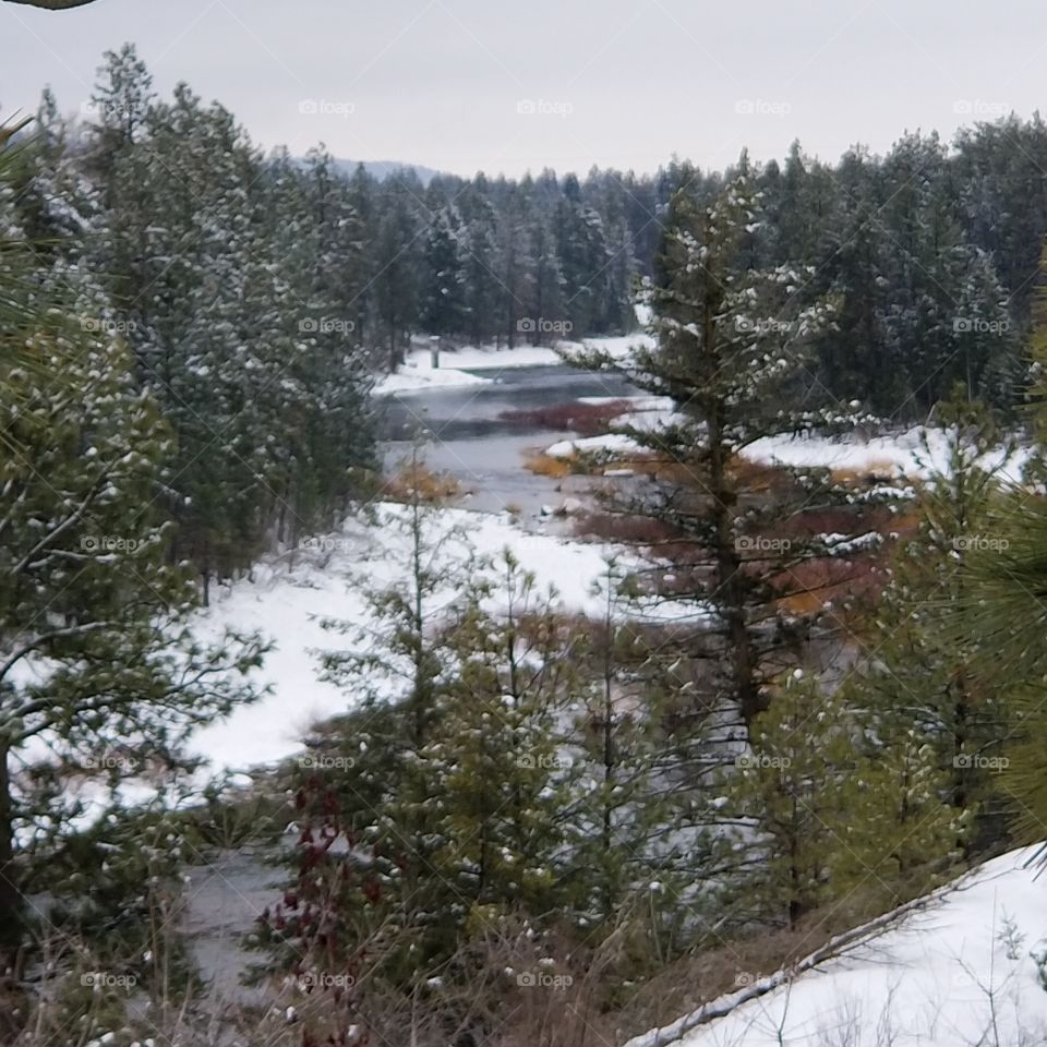 view of a flowing snowy river