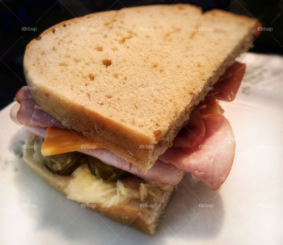 Turkey ham cheese dijon mustard sauerkraut pickles on cracked wheat sour dough  bread my favorite sandwich