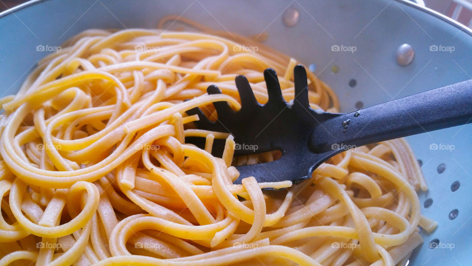 Close-up of spaghetti in colander