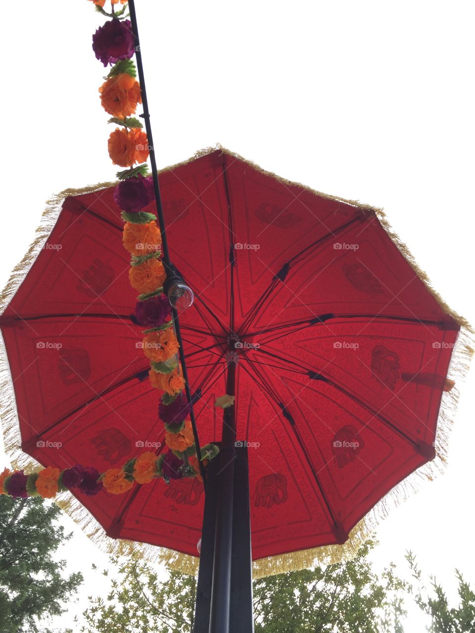 Red decorative umbrella made of fabric